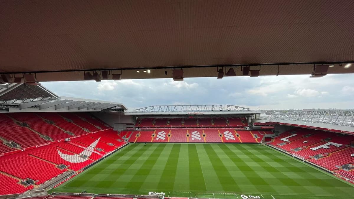 Anfield stadium's football pitch and red stands in May 2024