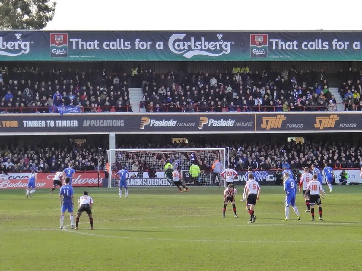Players challenging for the ball inside the penalty area