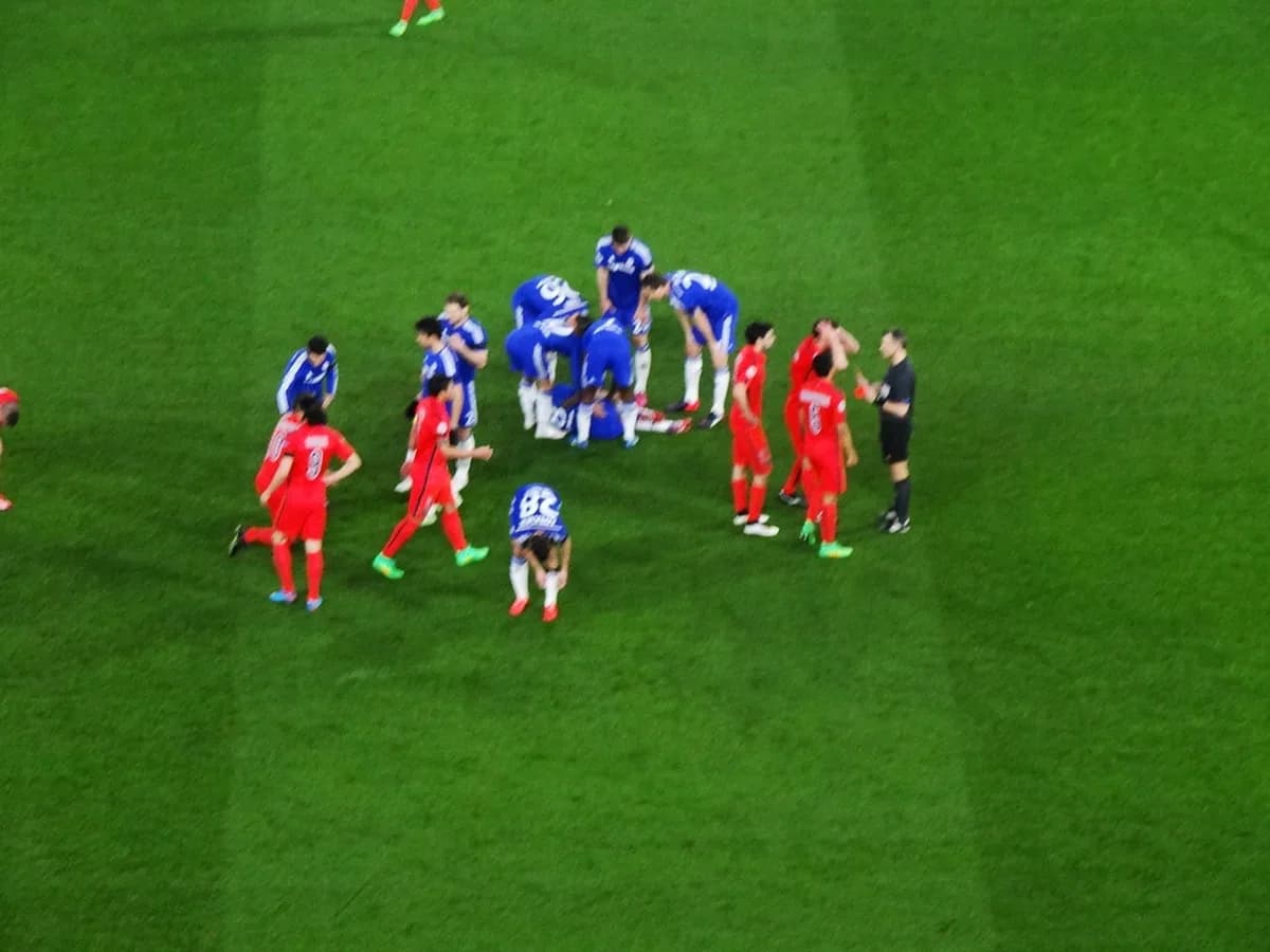 Football referee showing a card during a match