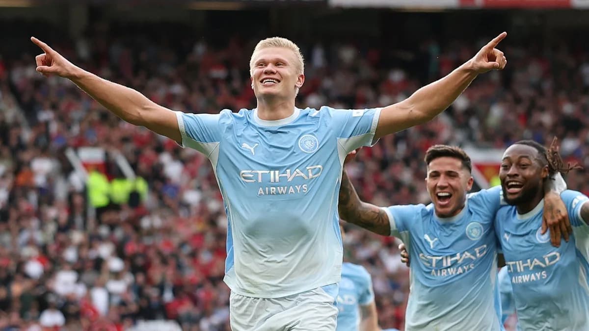 Erling Haaland celebrates with Manchester City teammates at Old Trafford