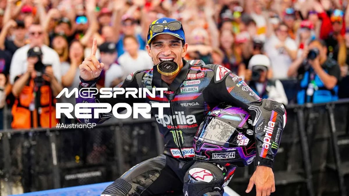 Jorge Martin bites his gold Sprint medal and raises one finger in front of a packed crowd of fans after winning the Austrian MotoGP Sprint