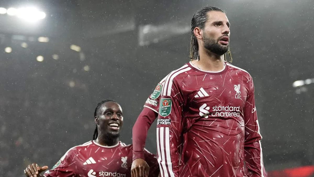 Dominik Szoboszlai celebrates in Liverpool red with a teammate behind him at Anfield