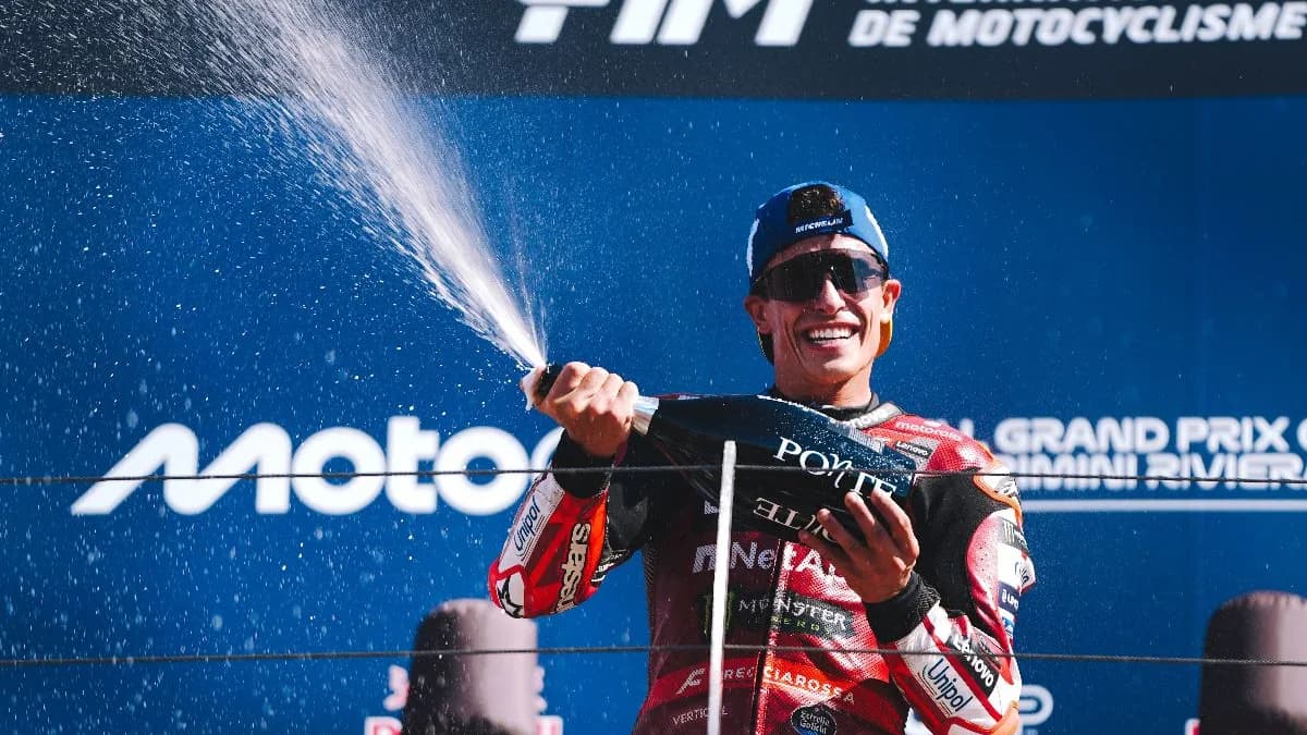 Marc Marquez sprays champagne on the San Marino Grand Prix podium
