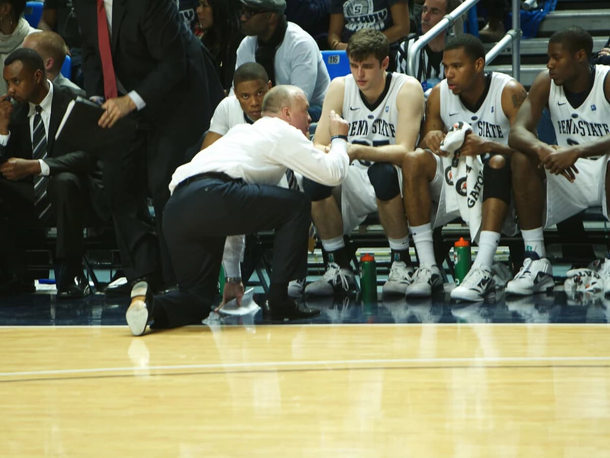 NBA bench players stretching during a timeout