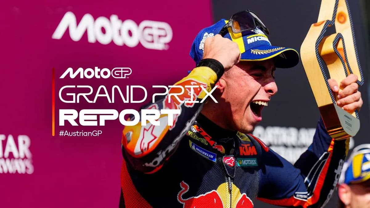 Pedro Acosta punches the air and roars with joy on the Red Bull Ring podium while holding the Austrian Grand Prix winner’s trophy