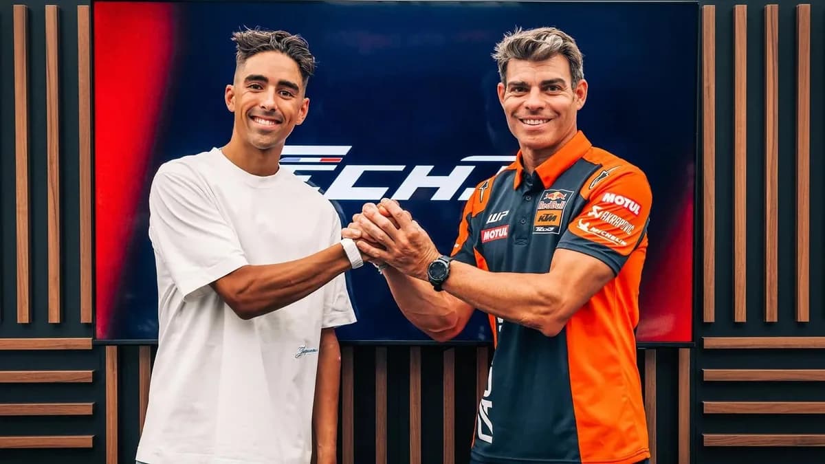 Senna Agius and Tech3 team manager Nicolas Goyon shake hands at the signing announcement
