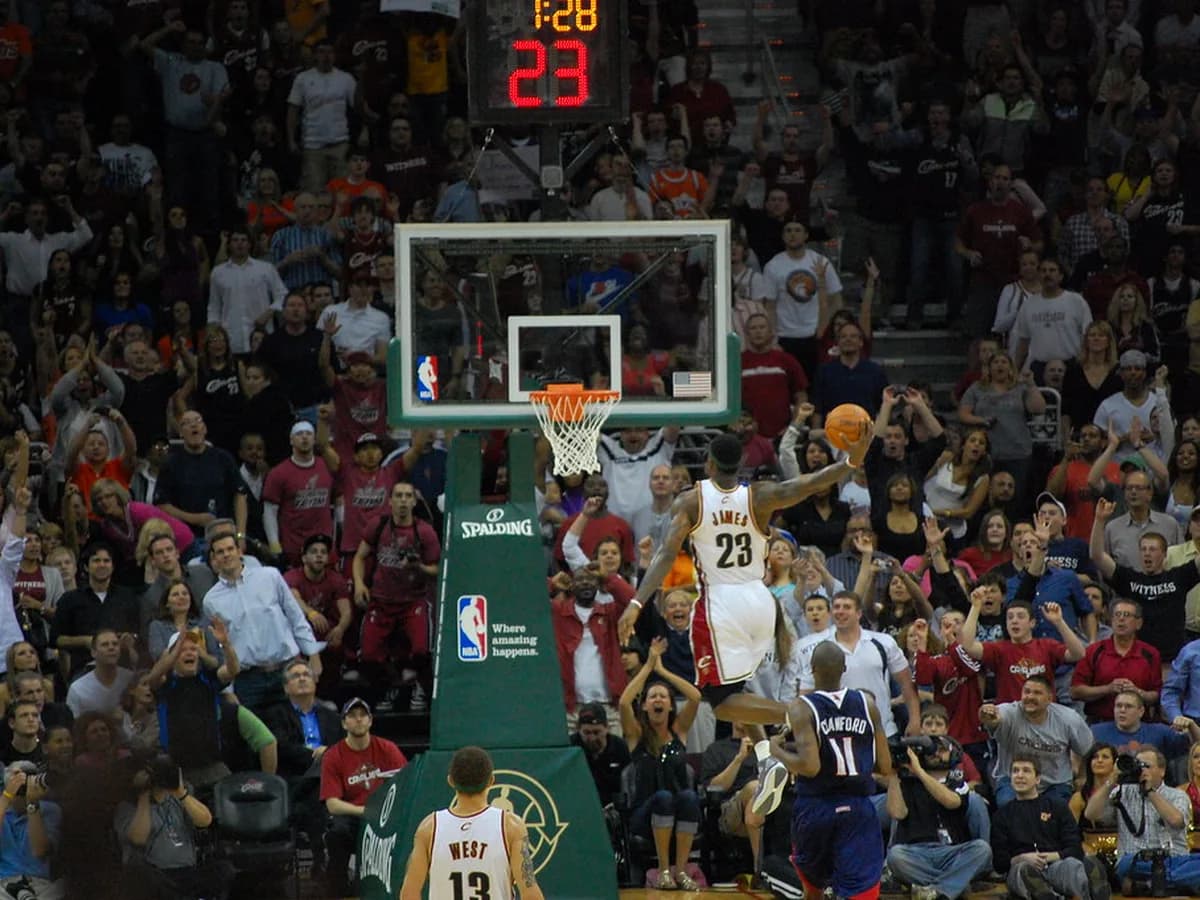 NBA players battling for position under the basket during a game